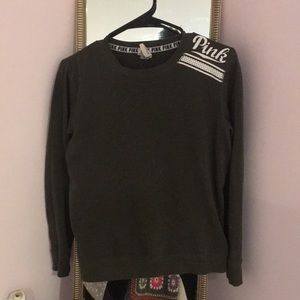 Green sweatshirt/top.